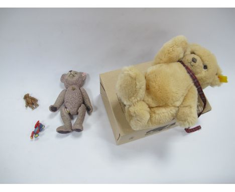 A Steiff Gold Plush Teddy Bear, 24cm high, Steiff pottery bear, two metal articulated bears, 4.5cm high. (4).