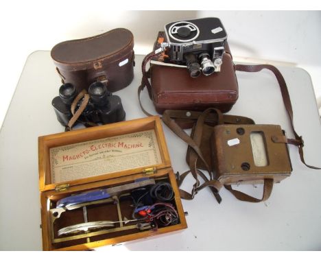 Cased binoculars, vintage cine camera, amp meter and an electric shock type machine 