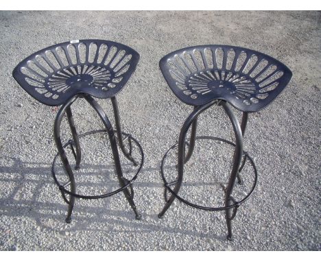 Pair of metal tractor seat style bar stools 