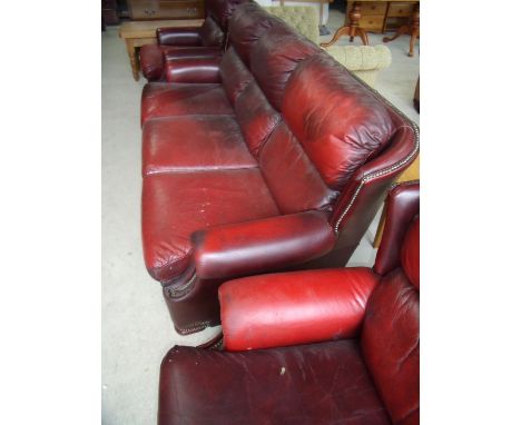 Three piece wingback leather suite comprising of three seat sofa and a pair of matching armchairs