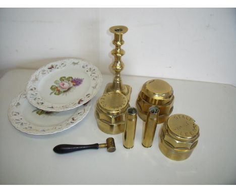 Three brass wheel hubs two by Kirkstall of Leeds, two brass shell cases, powder measure, brass candlestick and a pair of 19th