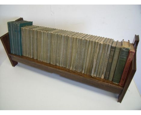 1920/30s oak book trough (width 65cm) with a selection of various books including the works of Shakespeare and Tennyson 