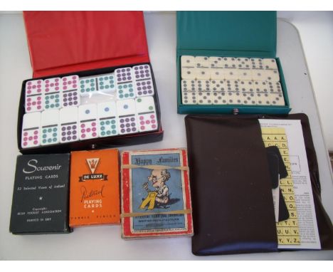 Two boxes of dominos, vintage playing cards, Happy Family's, Scrabble etc 