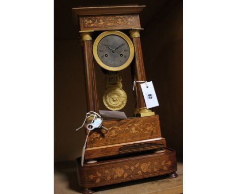 A 19th Century rosewood and inlaid portico mantel clock, the French eight-day bell striking movement regulated by a countwhee