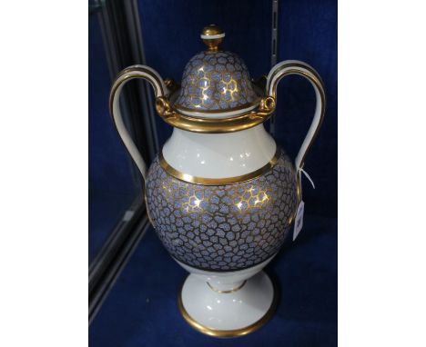 An English pearlware two-handled vase and cover, circa 1820, possibly Spode, decorated with a pale-blue and gilt cailloute gr