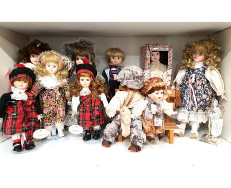 SELECTION OF TEN PORCELAIN HEAD DOLLScomprising NJSF Godfrey and Costantino seated on a bench, Victoria Collection Melissa Ja