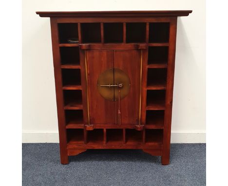 INDONESIAN HARDWOOD SIDE CABINETwith small square pigeon holes around a central cupboard with pin latch to the centre of the 