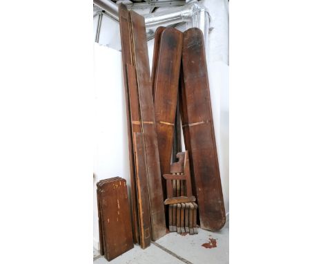 AN ASSORTMENT OF VICTORIAN  PITCH PINE PEW PARTScomprising seven lengths of seats, 306cm long, three gothic numbered sides, n