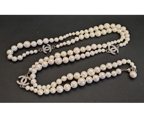 CHANEL FAUX PEARL AND CRYSTAL NECLACEthe graduated faux pearl sections interspersed with the three crystal set white metal CC