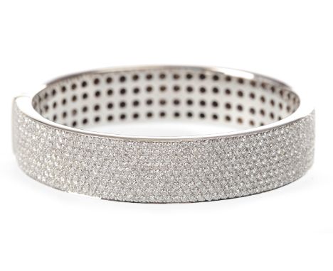 EIGHTEEN CARAT GOLD CASA GI DIAMOND BANGLE with pave set round brilliant cut diamonds totalling approximately 8.00 carats, 14