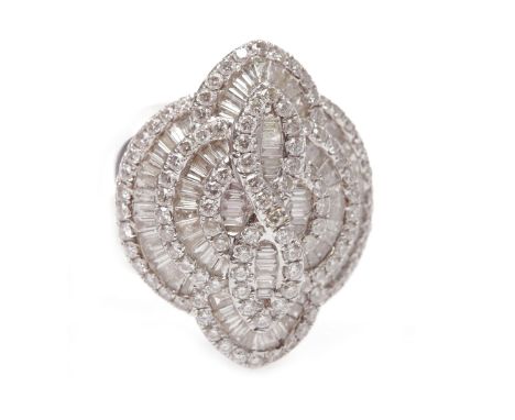 IMPRESSIVE DIAMOND DRESS RINGthe large bezel 27mm long with channel set taper cut diamond set sections surrounded by round br