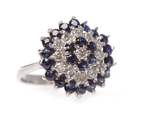 EIGHTEEN CARAT WHITE GOLD SAPPHIRE AND DIAMOND CLUSTER RINGthe hexagonal bezel 17.5mm wide and set with rows of round sapphir