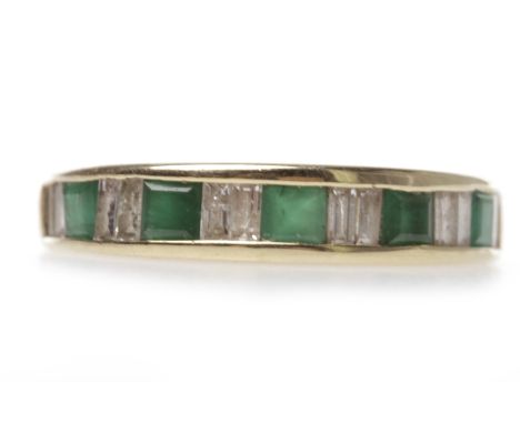 NINE CARAT GOLD EMERALD AND DIAMOND HALF ETERNITY RINGwith pairs of channel set baguette cut diamonds alternating with single