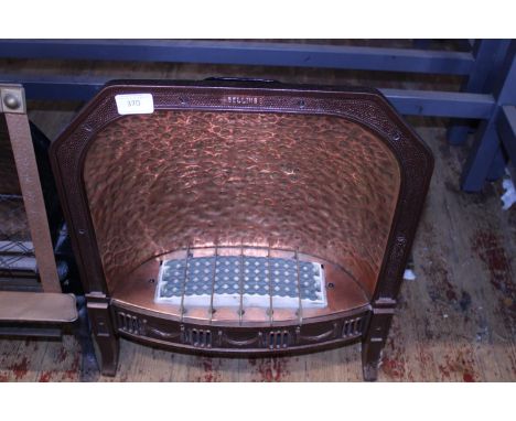 A vintage copper bodied electric fire. postage unavailable. 