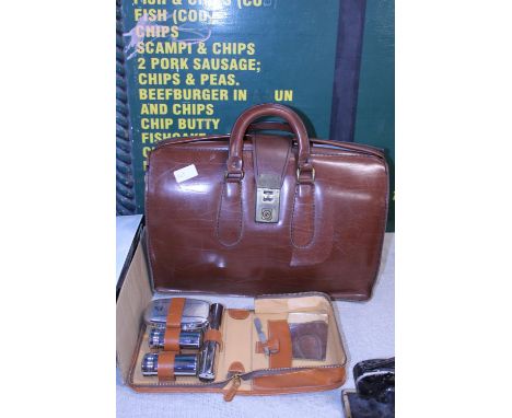 A vintage leather briefcase and a men's vanity set 