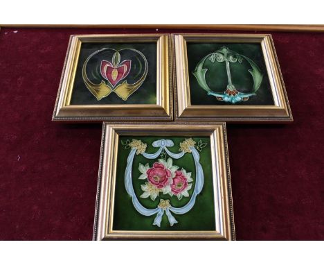 Three framed Art Nouveu style ceramic tiles 