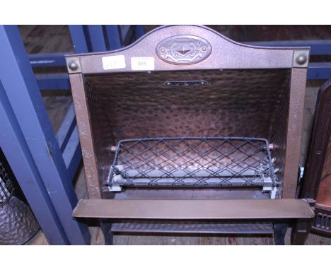 A vintage copper bodied electric fire. postage unavailable. 