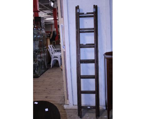 a set of vintage wooden ladders. postage unavailable. 