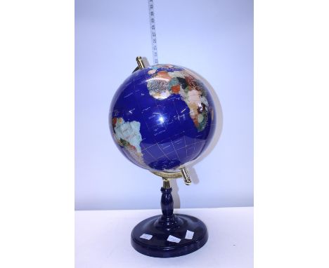 A semi-precious stone globe on stand. postage unavailable. 