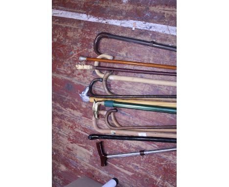 A selection of assorted vintage walking sticks including a bone handle example.  Shipping unavailable 