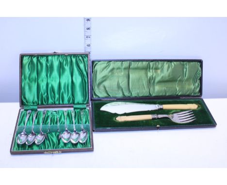 A boxed fish serving set with silver mounts and one other set of vintage cutlery 