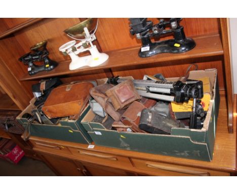 Two boxes of various cameras; tripod and various accessories 