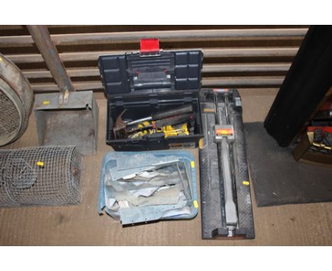 A tool box and contents; tile cutter etc. 