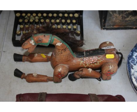 A wooden horse puppet 