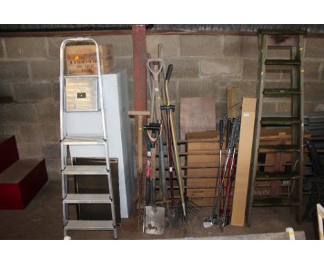 A quantity of long handled gardening tools