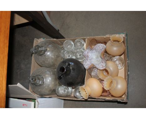 A box containing various glassware to include art glass bowl; glass light shades; demijohns etc.  