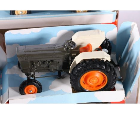 Britains Ltd tractor models including 9524 Ford and 9420 farm tractor, also a 9671 Land Rover, each boxed. (3) 