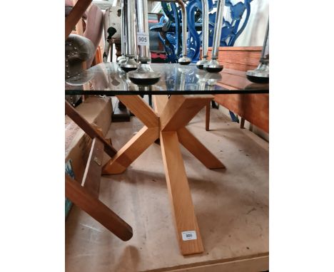 A modern light oak and glass top coffee table, length 90cm. 