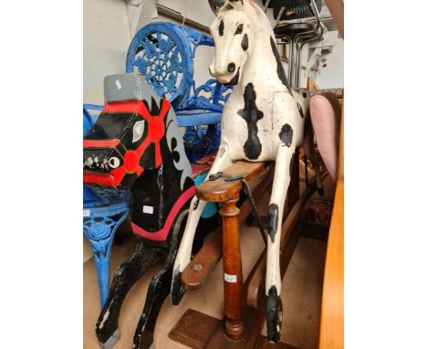 A vintage rocking horse (off it's rocker), together with a vintage fairground carousel horse. 