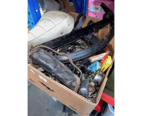 A box of vintage bicycle parts, seats, bells, chain guards, etc. 