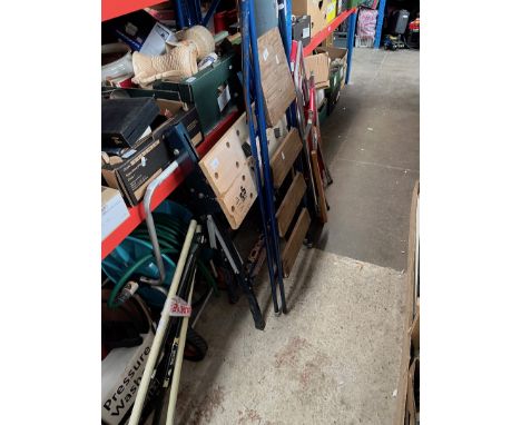 A pressure washer, workbench, garden hose reel on wheels, Flymo mower, lawn edger, metal step ladder and 2 wind breaks 