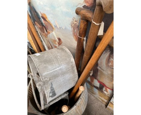 A galvanised watering can, a galvanised mop bucket and a selection of garden tools, spade, fork, shears, lopper, etc. 