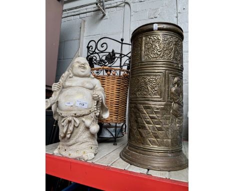 A brass stick stand, a metal and wicker stick stand and a composite Buddha. 