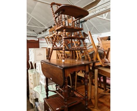 A mahogany drop leaf table and a vintage child's high chair. 