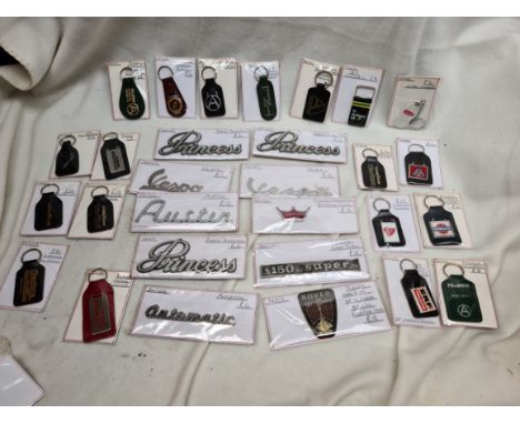 A box of vintage motor scripts &amp; keyrings