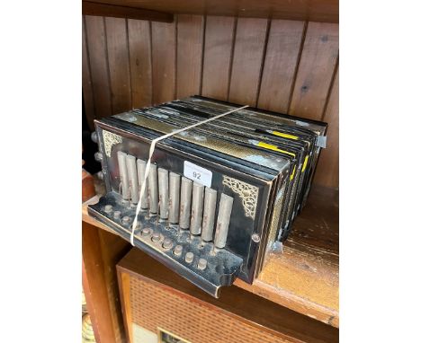 An antique button accordion 