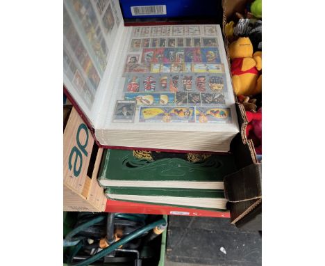 2 volumes "Animals of the world" first edition and an album containing Victorian and other Commonwealth stamps. 