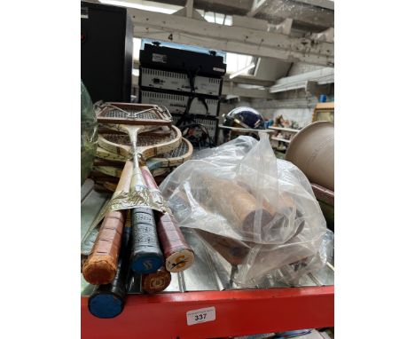 Vintage sports equipment including tennis racquets and rounders bats 