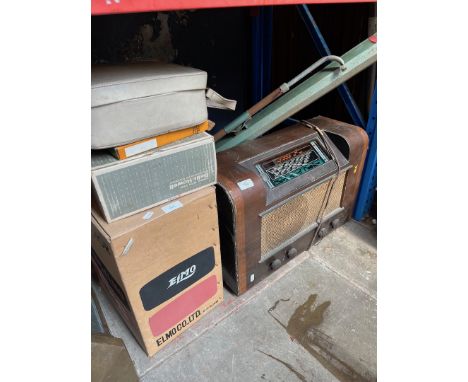 An 8mm cine camera, projector, film reels and screen together with a radiogram.Model Ilfor Elmo EP-C, various reels related t