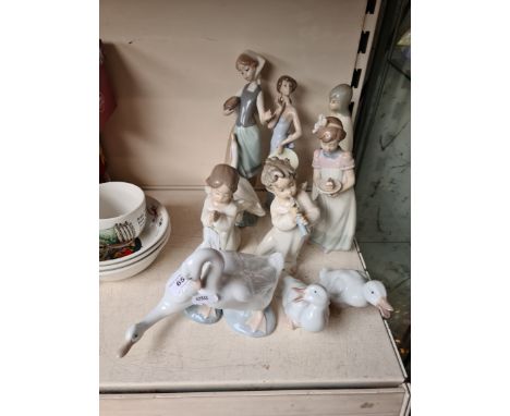 Five Lladro figures and four Nao geese 