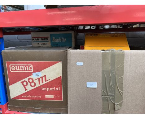 A Eumig 8mm cine projector, various reels, a Hanimex movie editor, a slide projector, various cameras, a reel to reel player,