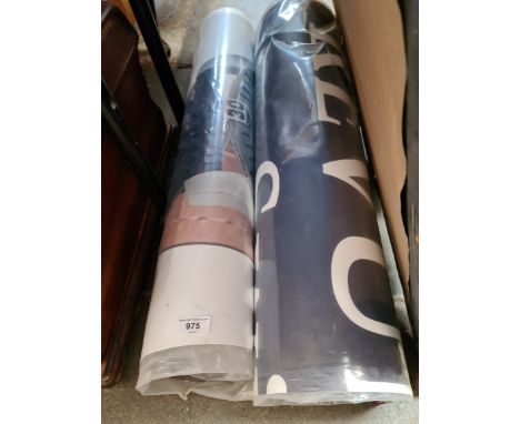 A large laminated clock poster and another part poster. 