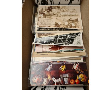 A box of vintage postcards and a file of vintage theatre programs 