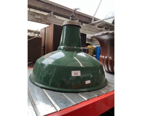 A green enamelled industrial light fitting / shade. 