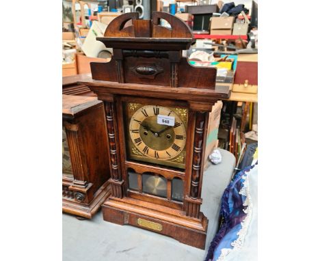 A walnut mantle clock, height 58cm. 