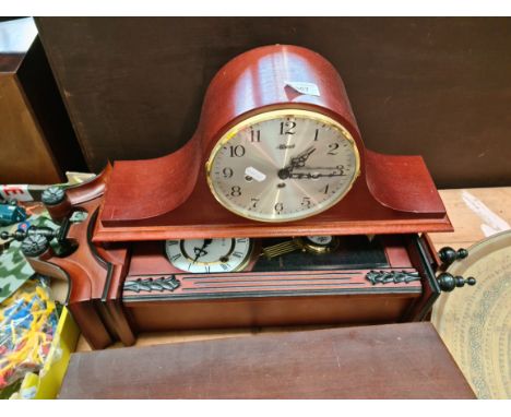 A wall clock and a mantel clock. 